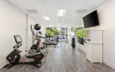 Fitness center with natural light at The Anaheim Hotel.