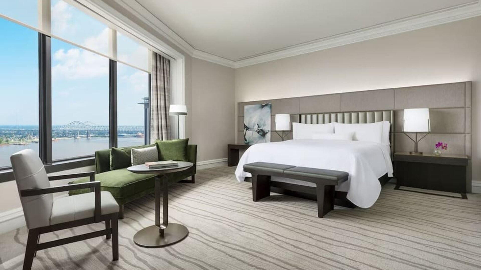Comfortable king bedroom and a view of the river at The Westin New Orleans.