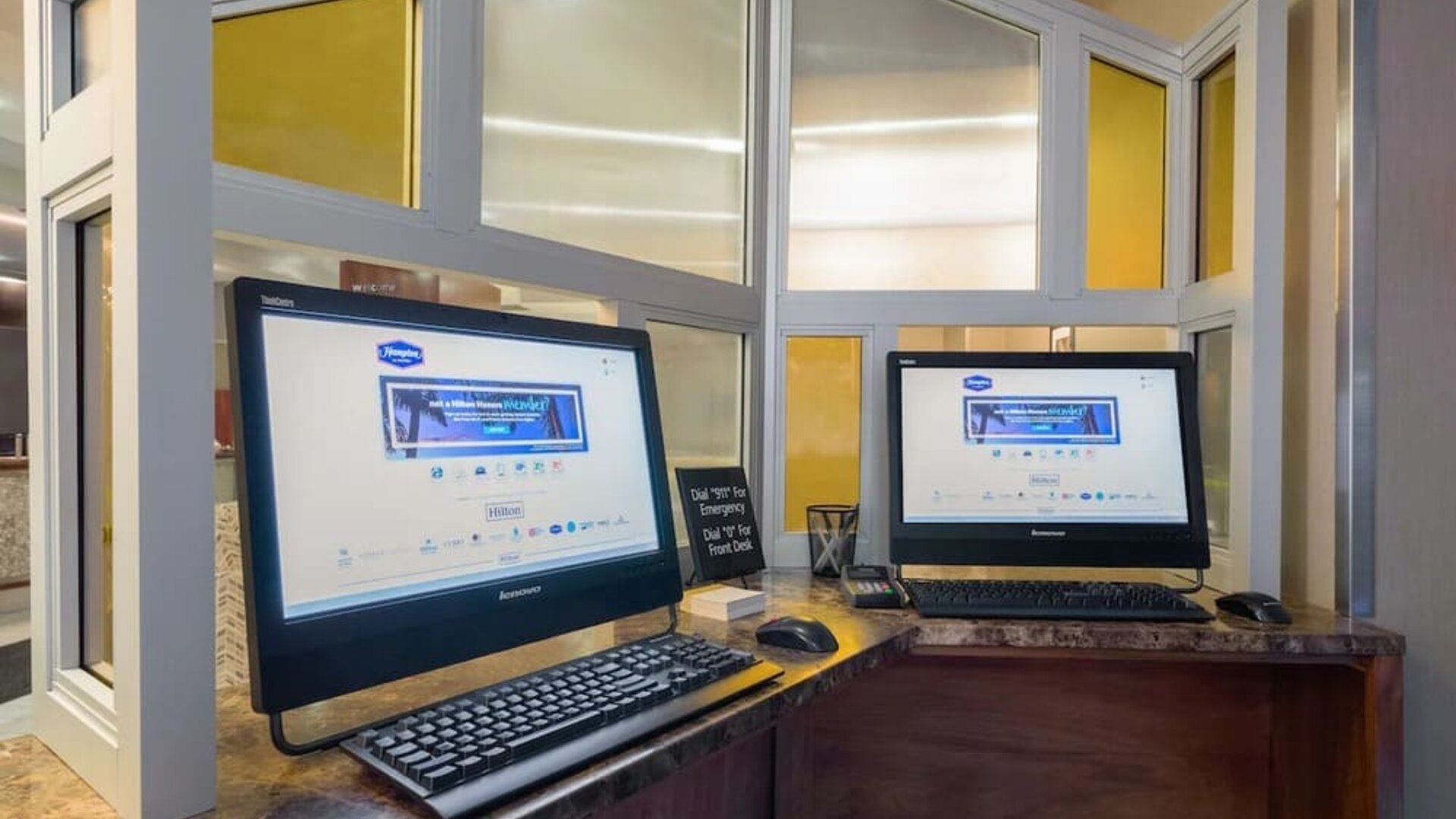 Business center with computers and printer at Hampton Inn Manhattan - Madison Square Garden.