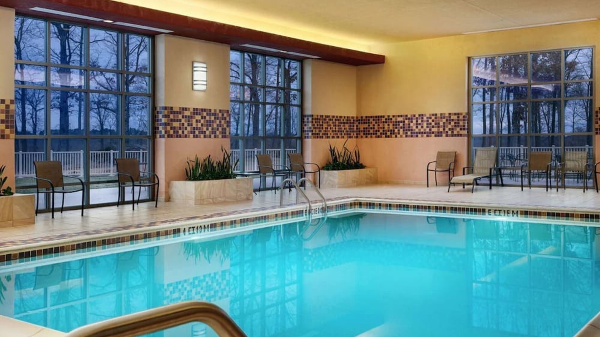 Beautiful indoor pool at Embassy Suites By Hilton Charlotte-Concord-Golf Resort & Spa.