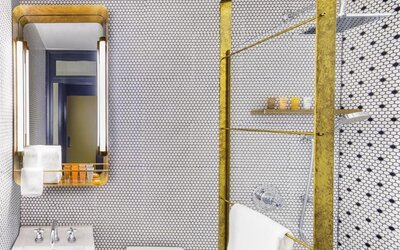 Private guest bathroom with shower and free toiletries at Hotel Shocard NYC.