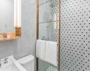 Private guest bathroom with shower at Hotel Shocard NYC.