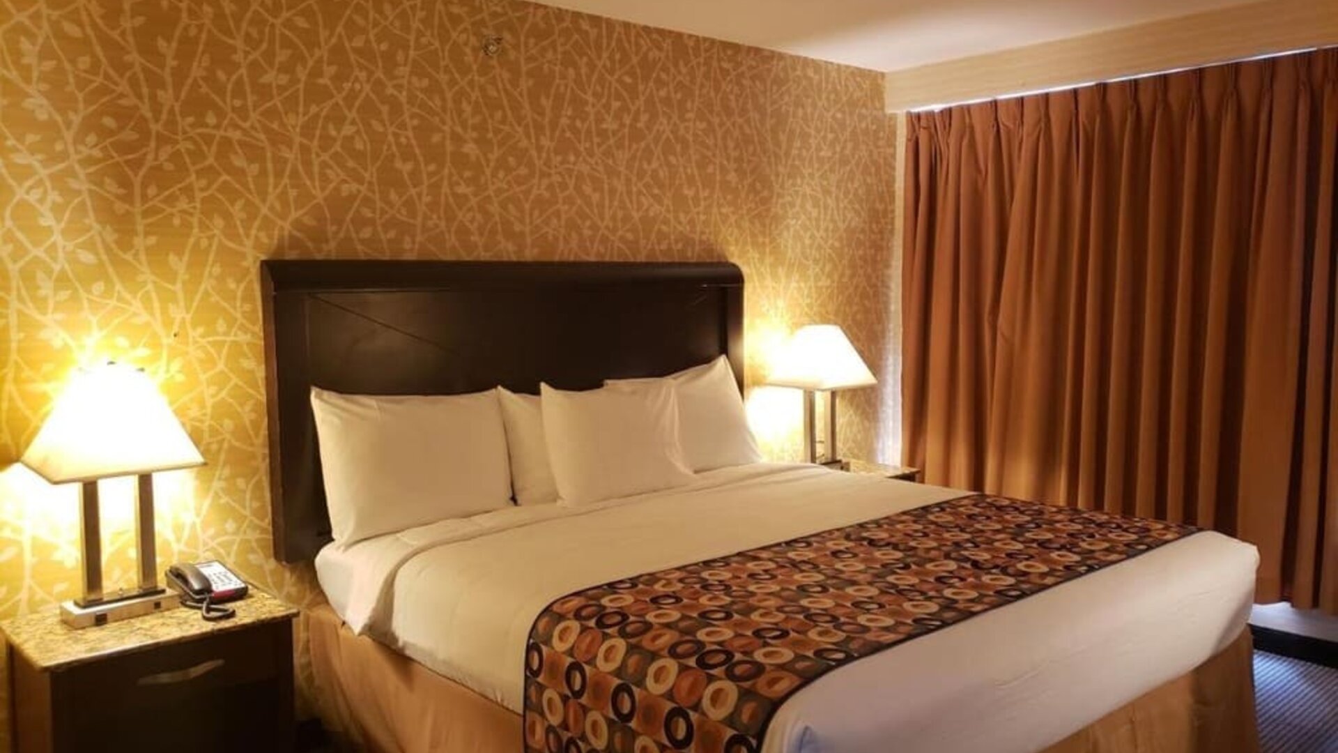 King bed at Elmhurst Hotel.