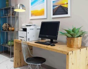 Business center with computer and printer at Days Inn By Wyndham Staten Island.