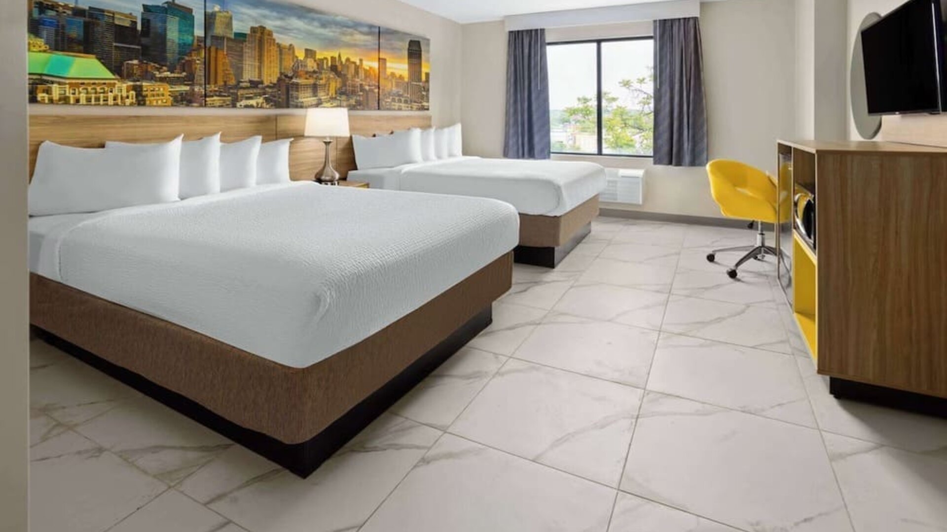 Day use twin room with work desk and private bathroom at Days Inn By Wyndham Staten Island.