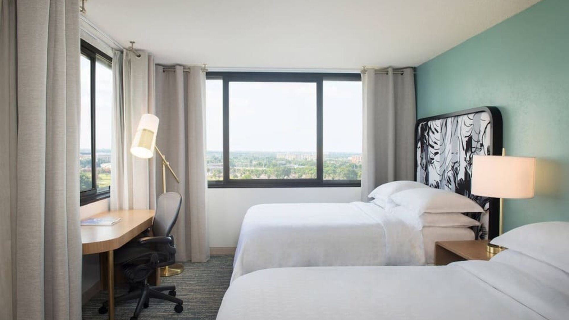 Day use twin room with work desk and private bathroom at Sheraton Miami Airport Hotel.