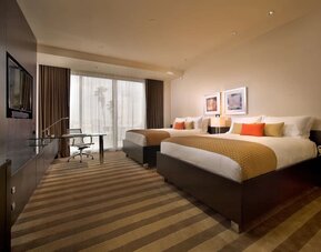 Day use twin room with work desk and private bathroom at EB Hotel Miami.