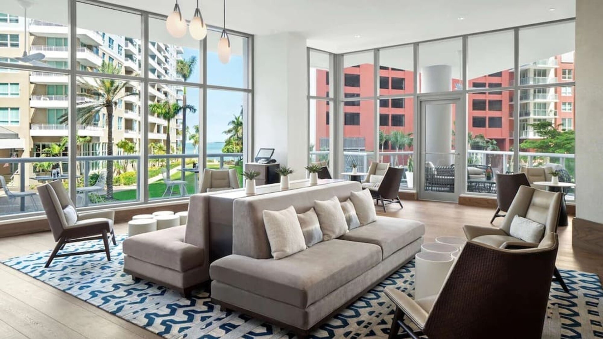 Hotel lobby with comfortable seating and floor to ceiling windows at Hyatt Centric Brickell Miami.