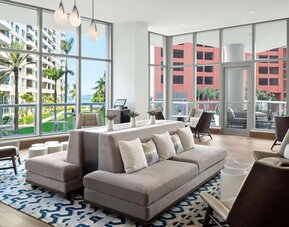Hotel lobby with comfortable seating and floor to ceiling windows at Hyatt Centric Brickell Miami.