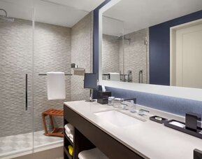 Private guest bathroom with shower and free toiletries at Hyatt Centric Brickell Miami.