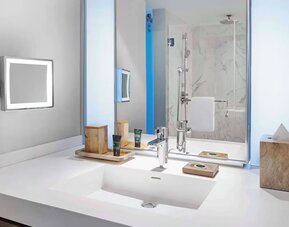 Private guest bathroom with shower and free toiletries at Hyatt Centric Miami South Beach.