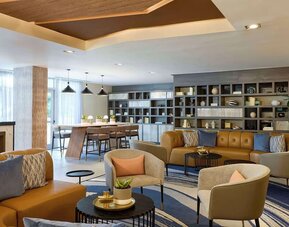 Lounge area and workspace with comfortable seating, perfect for co-working at Hyatt Centric Miami South Beach.