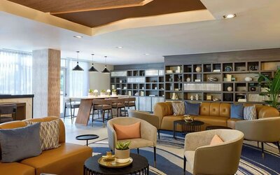 Lounge area and workspace with comfortable seating, perfect for co-working at Hyatt Centric Miami South Beach.