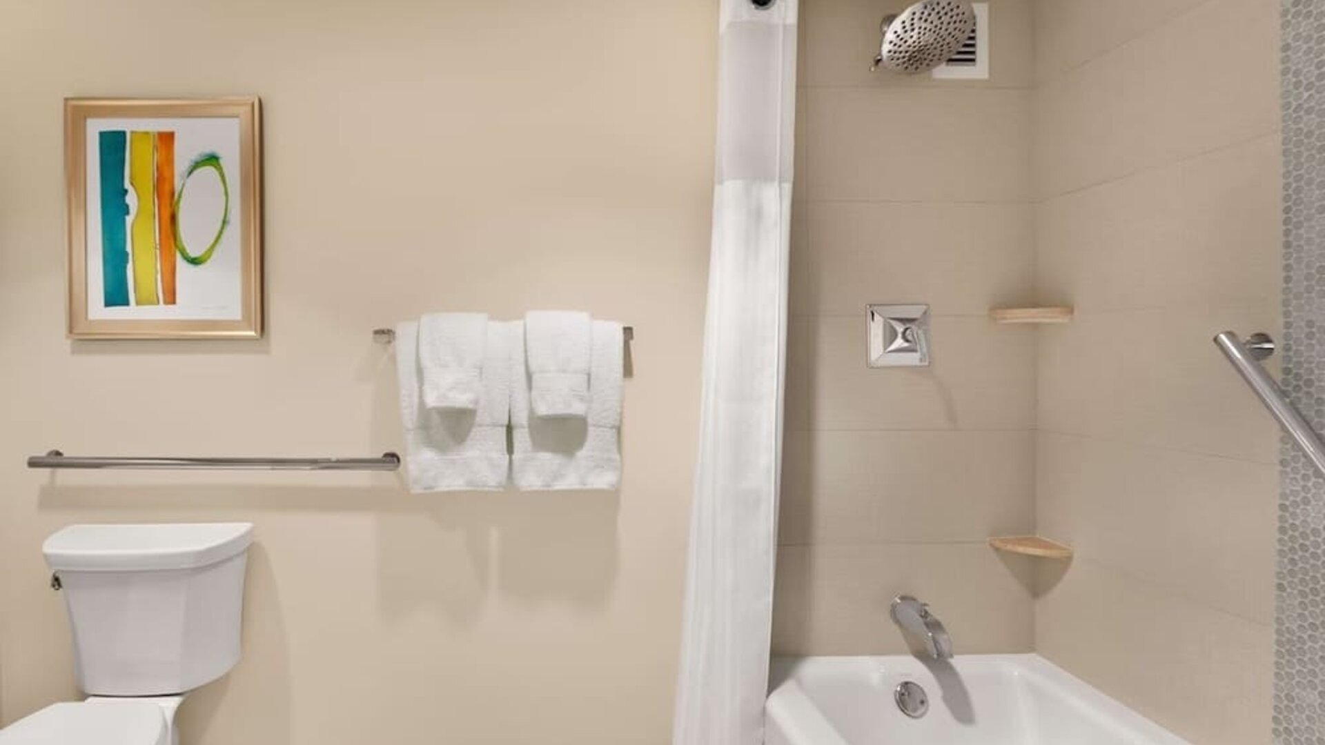 Private guest bathroo with combined shower and tub at Hilton Miami Airport Blue Lagoon.