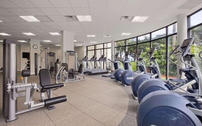 Fully equipped fitness center at Hilton Miami Airport Blue Lagoon.