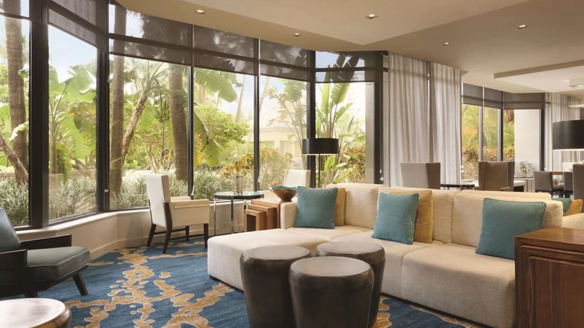 Hotel lobby with comfortable seating and workspace at Hilton Miami Airport Blue Lagoon.