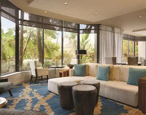 Hotel lobby with comfortable seating and workspace at Hilton Miami Airport Blue Lagoon.