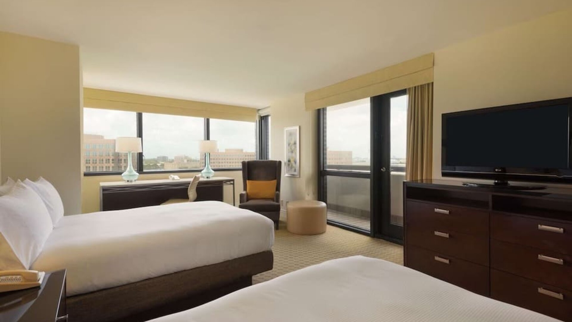 Day use twin room with work desk, balcony and private bathroom at Hilton Miami Airport Blue Lagoon.