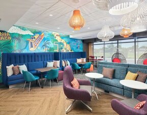 Lounge and coworking space at Tru By Hilton Ft. Lauderdale Airport.