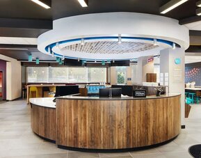 Reception desk at Tru By Hilton Atlanta Northlake Parkway.