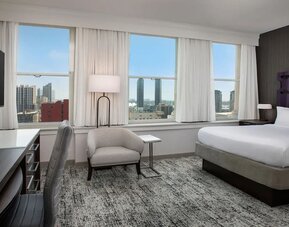 Spacious day use room with work desk and natural light at Courtyard San Diego Downtown.