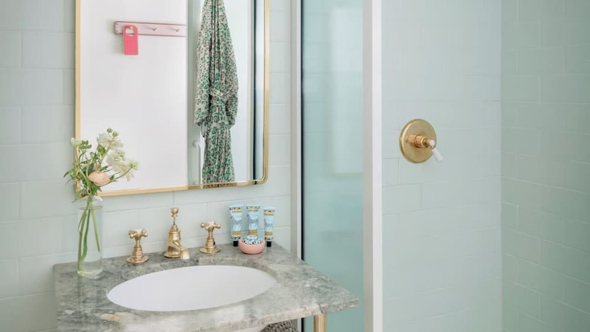Private bathroom with shower and free toiletries at The Goodtime Hotel.