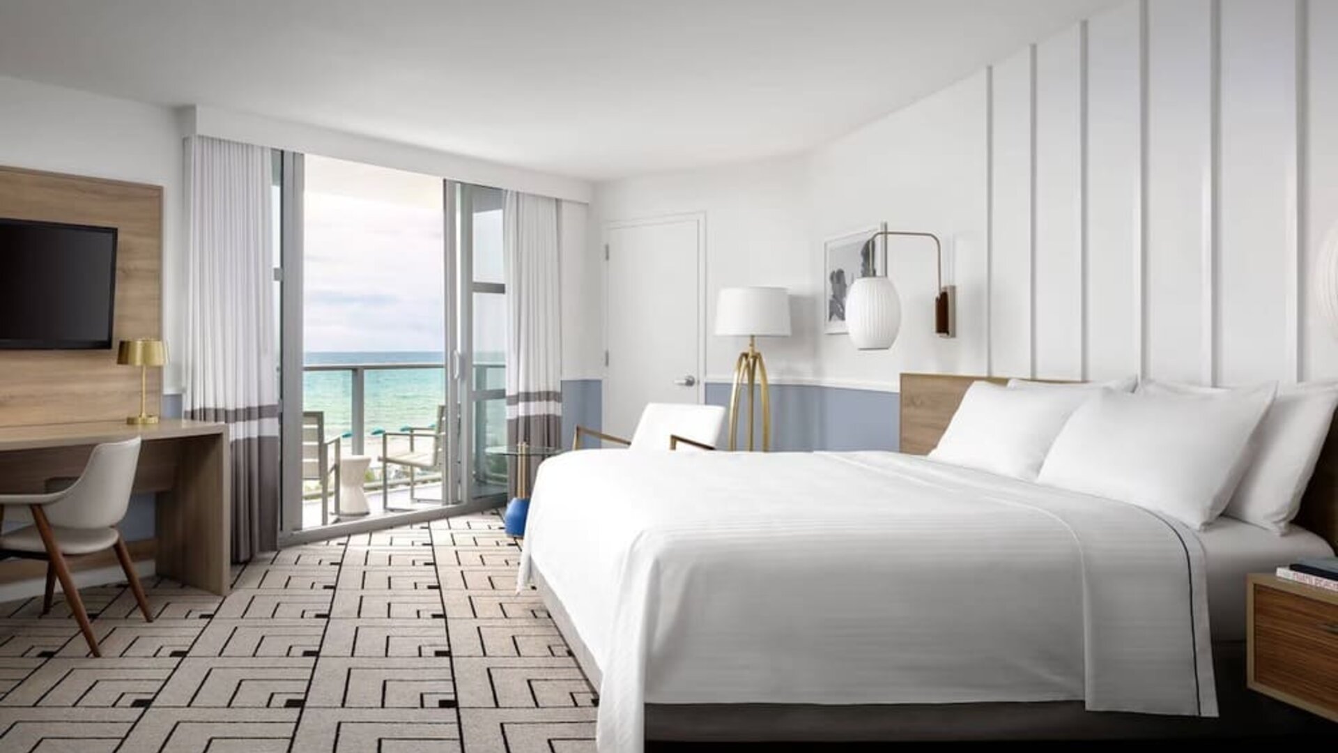 Day use room with king bed, work desk, balcony and private bathroom at Cadillac Hotel & Beach Club, Autograph Collection.