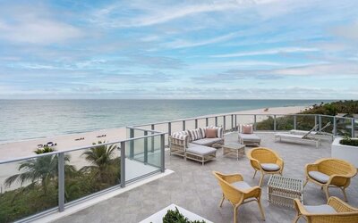 Terrace lounge seating with beautiful view at Cadillac Hotel & Beach Club, Autograph Collection.