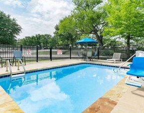 Outdoor pool at Microtel Inn And Suites By Wyndham Austin Airport.