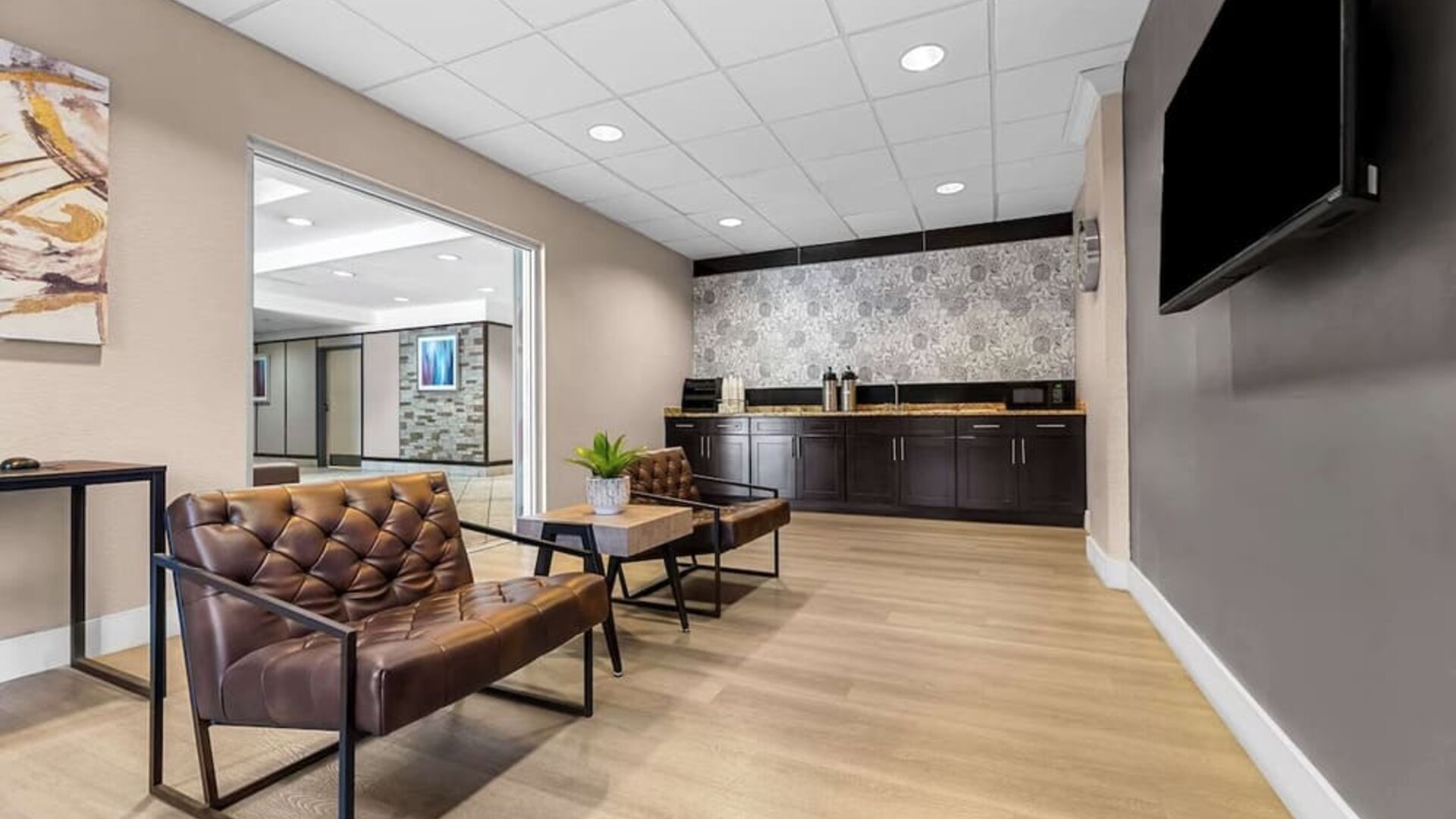 Lobby and coworking space at Suburban Studios Orlando - Ocoee/Winter Garden.