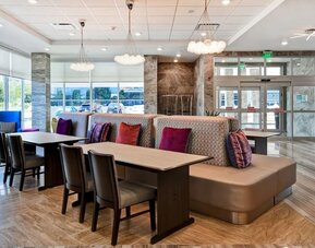 Coworking space and lounge at Home2 Suites By Hilton San Francisco Airport North.