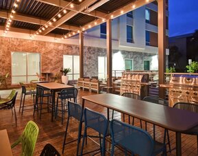 Outdoor seating at Home2 Suites By Hilton San Francisco Airport North.