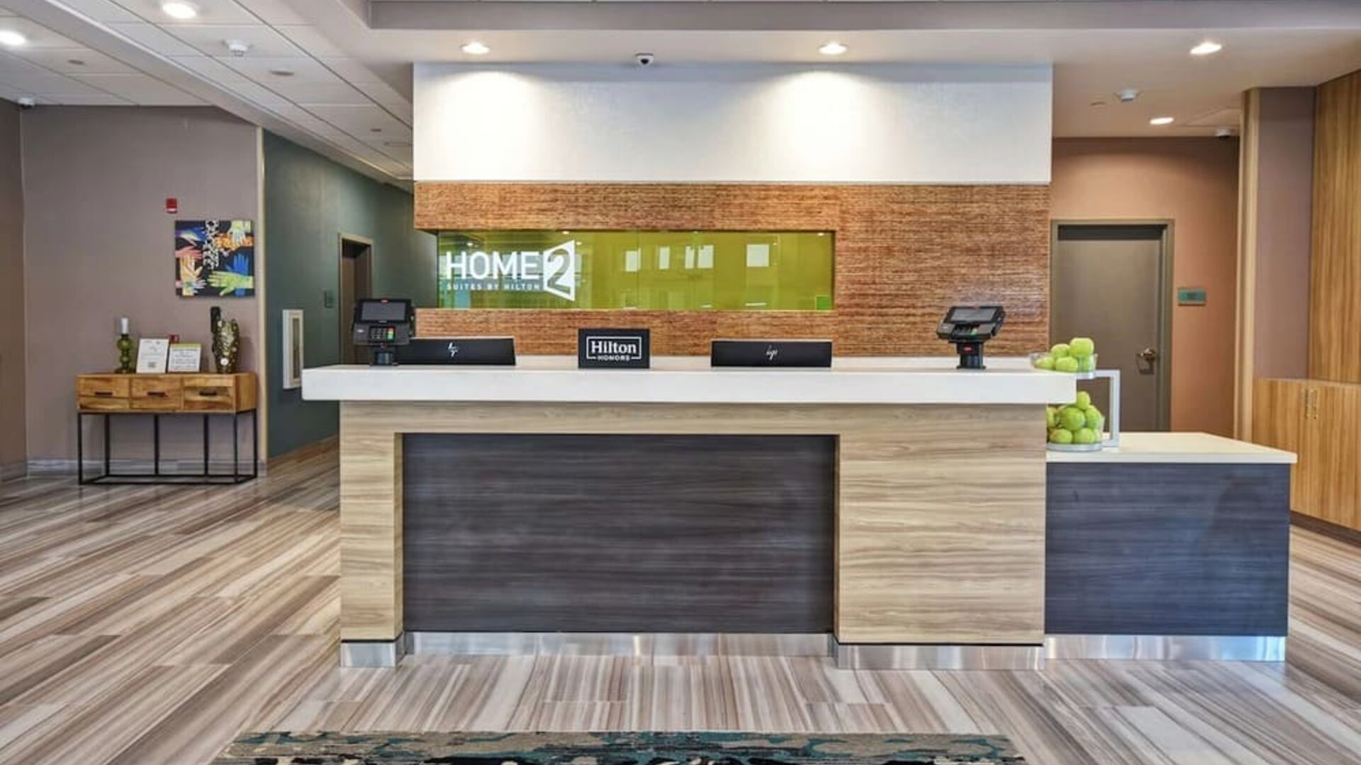 Reception desk at Home2 Suites By Hilton San Francisco Airport North.