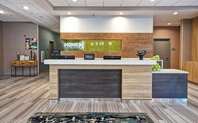 Reception desk at Home2 Suites By Hilton San Francisco Airport North.