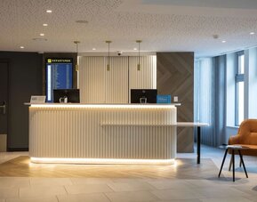 Reception desk at Hilton Garden Inn Paris Orly Airport.
