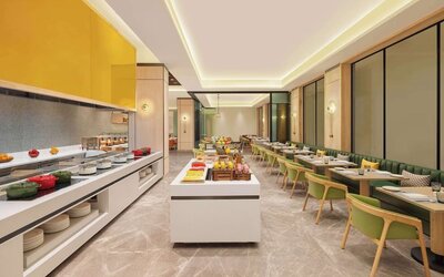 Dining area at Hilton Garden Inn Surat City Centre.