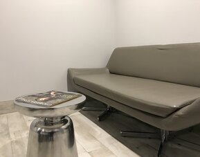 Sofa inside day use room at Ramsey Inn & Suites.