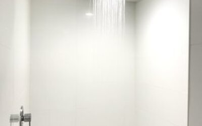 Guest bathroom with shower at Ramsey Inn & Suites.