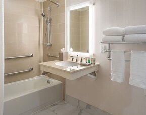 Guest bathroom with shower and tub  at Westin Atlanta Airport Hotel.
