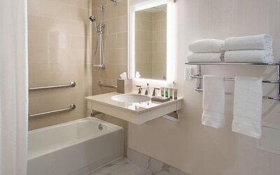 Guest bathroom with shower and tub  at Westin Atlanta Airport Hotel.