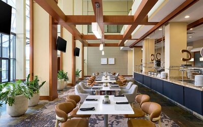Dining area with natural light perfect for coworking at Westin Atlanta Airport Hotel.