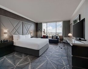 Day use room with work desk and sofa at Hilton Atlanta.