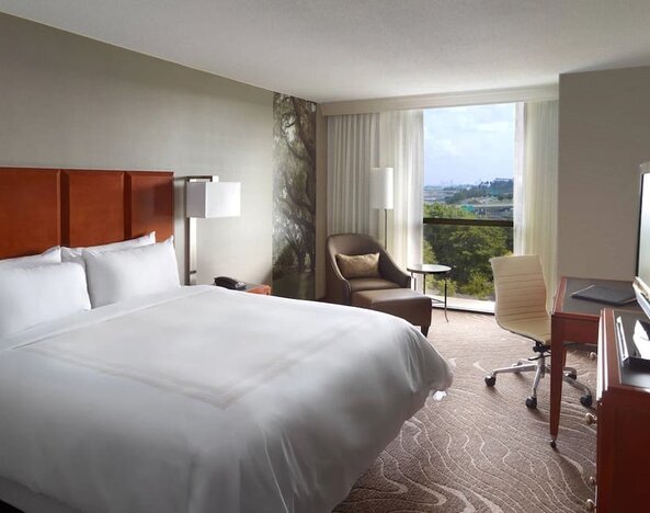 King bedroom with workstation and natural light at Atlanta Marriott Northwest At Galleria.