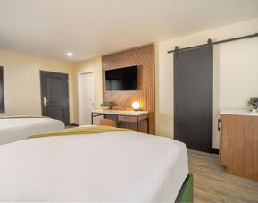 Day use room with TV and natural light at LYFE INN & SUITES By AGA.