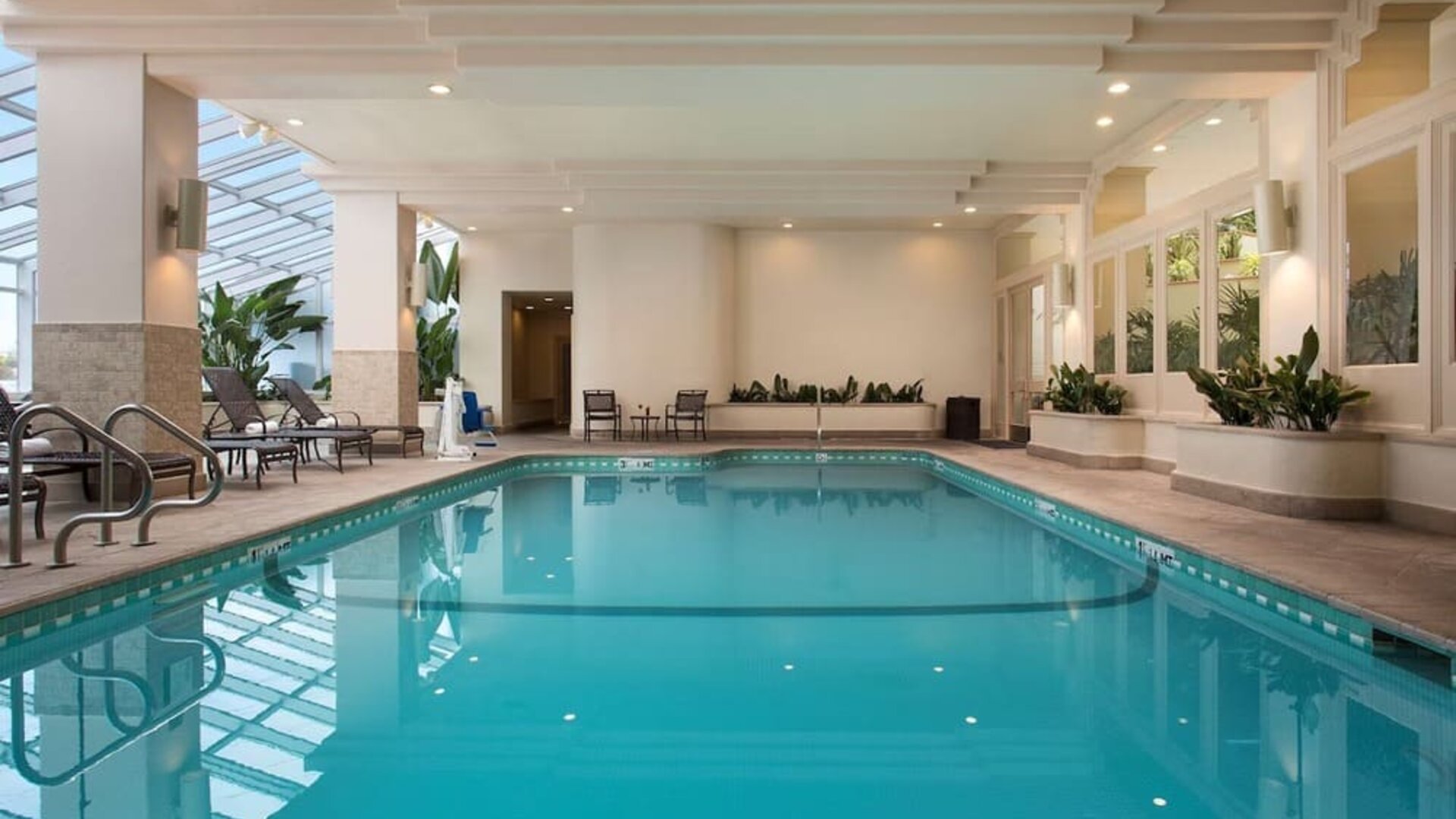 Relaxing indoor pool at Embassy Suites by Hilton San Francisco Airport.