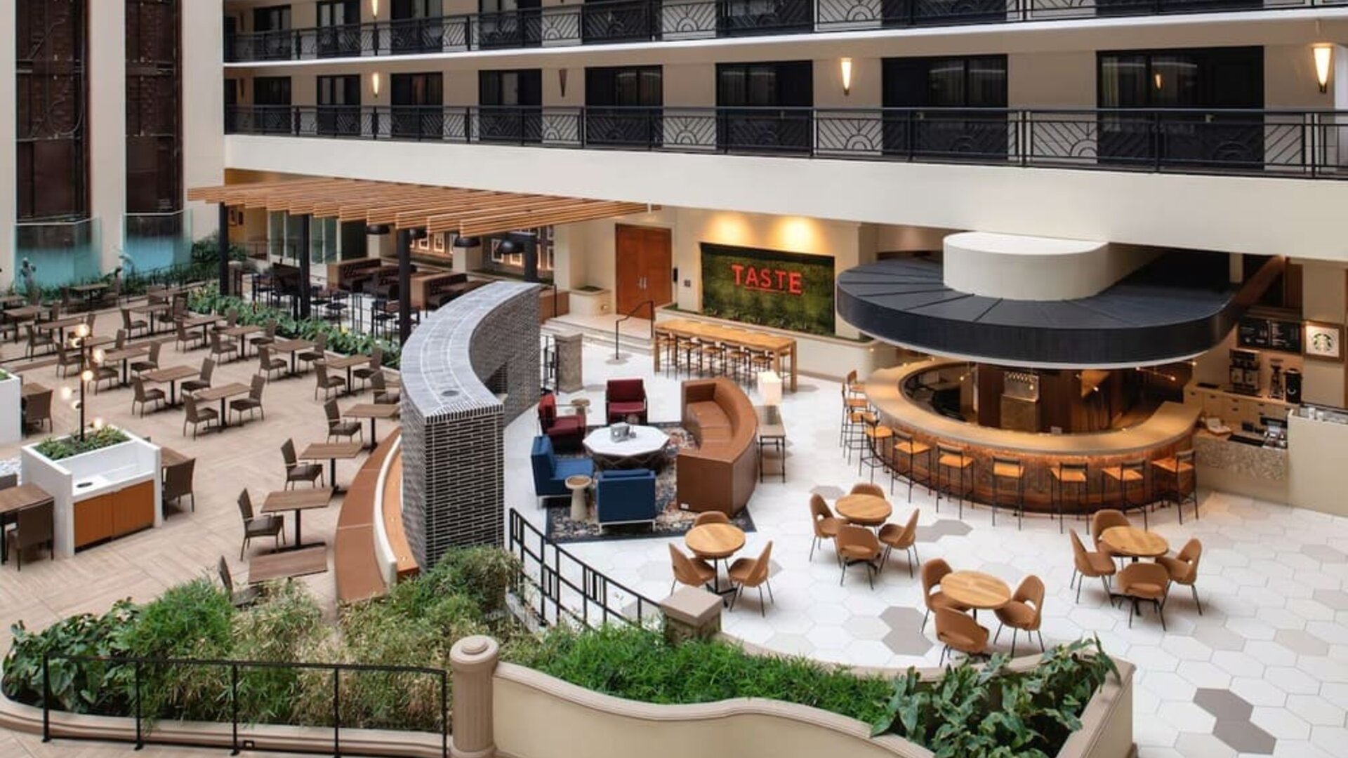 Spacious dining and lounge area perfect for coworking at Embassy Suites by Hilton San Francisco Airport.