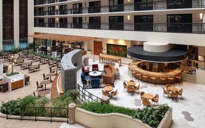 Spacious dining and lounge area perfect for coworking at Embassy Suites by Hilton San Francisco Airport.