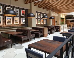 Dining area perfect for coworking at Embassy Suites by Hilton San Francisco Airport.