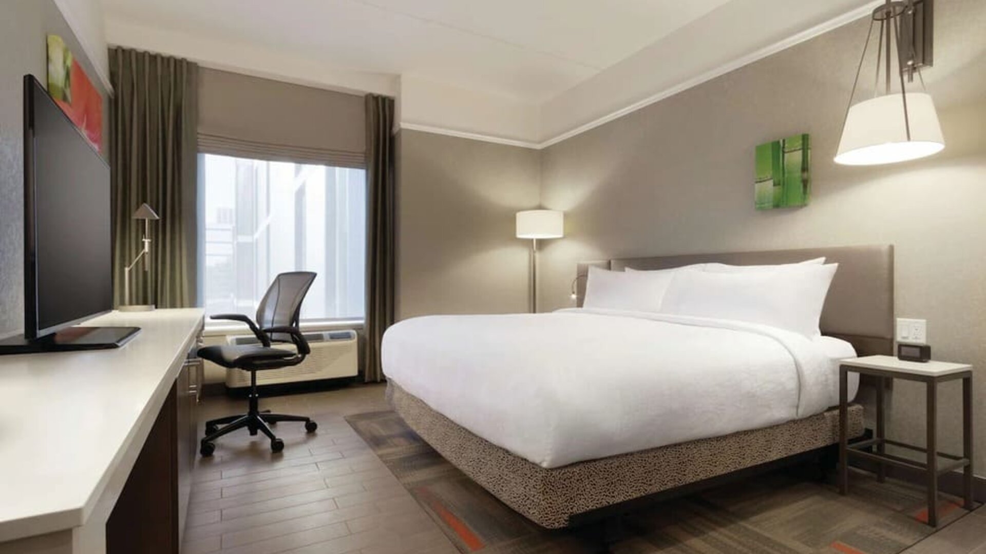 Spacious king room with work desk at Hilton Garden Inn Calgary Downtown.
