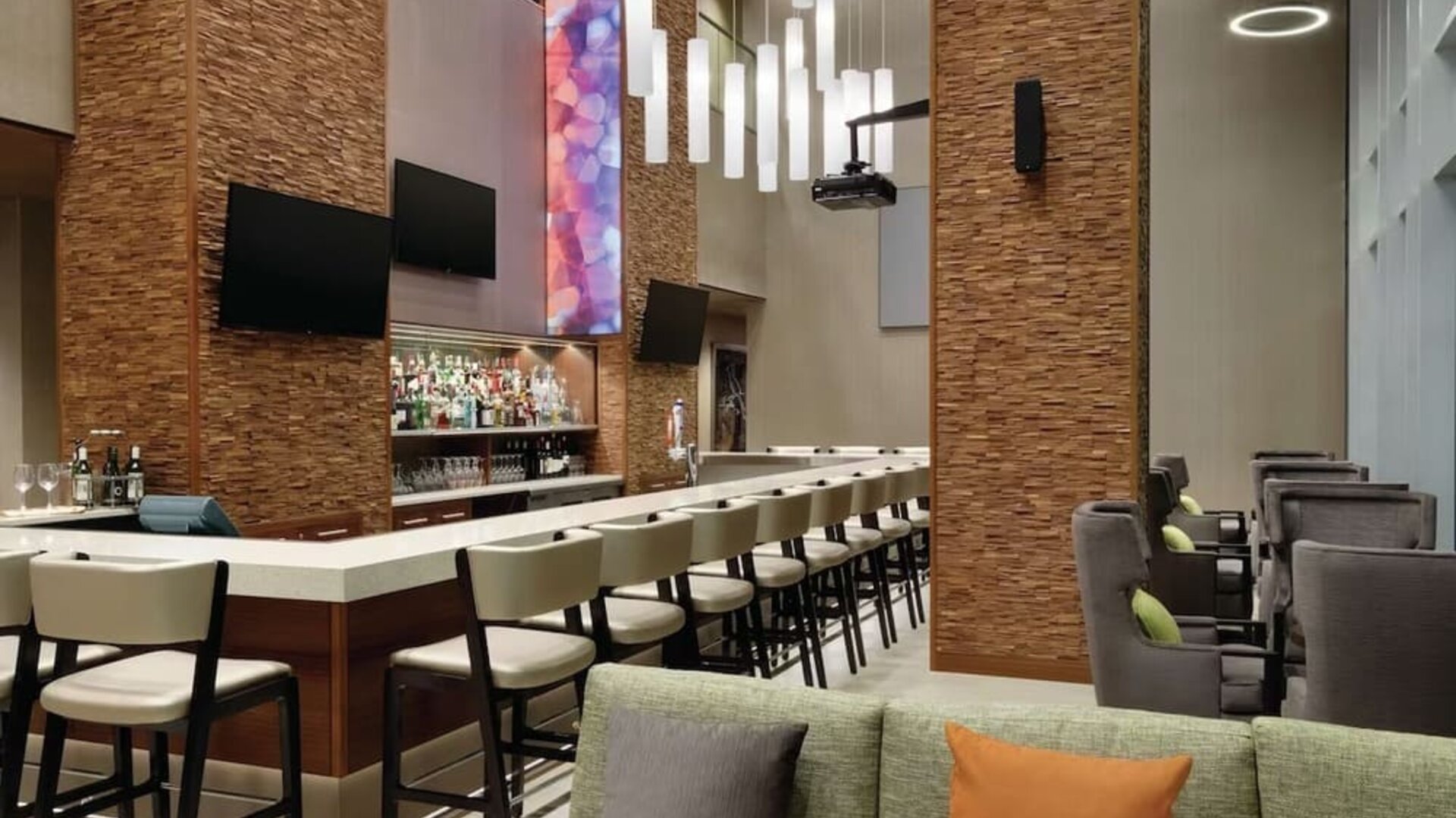 Hotel bar with ample seats at Hilton Garden Inn Calgary Downtown.